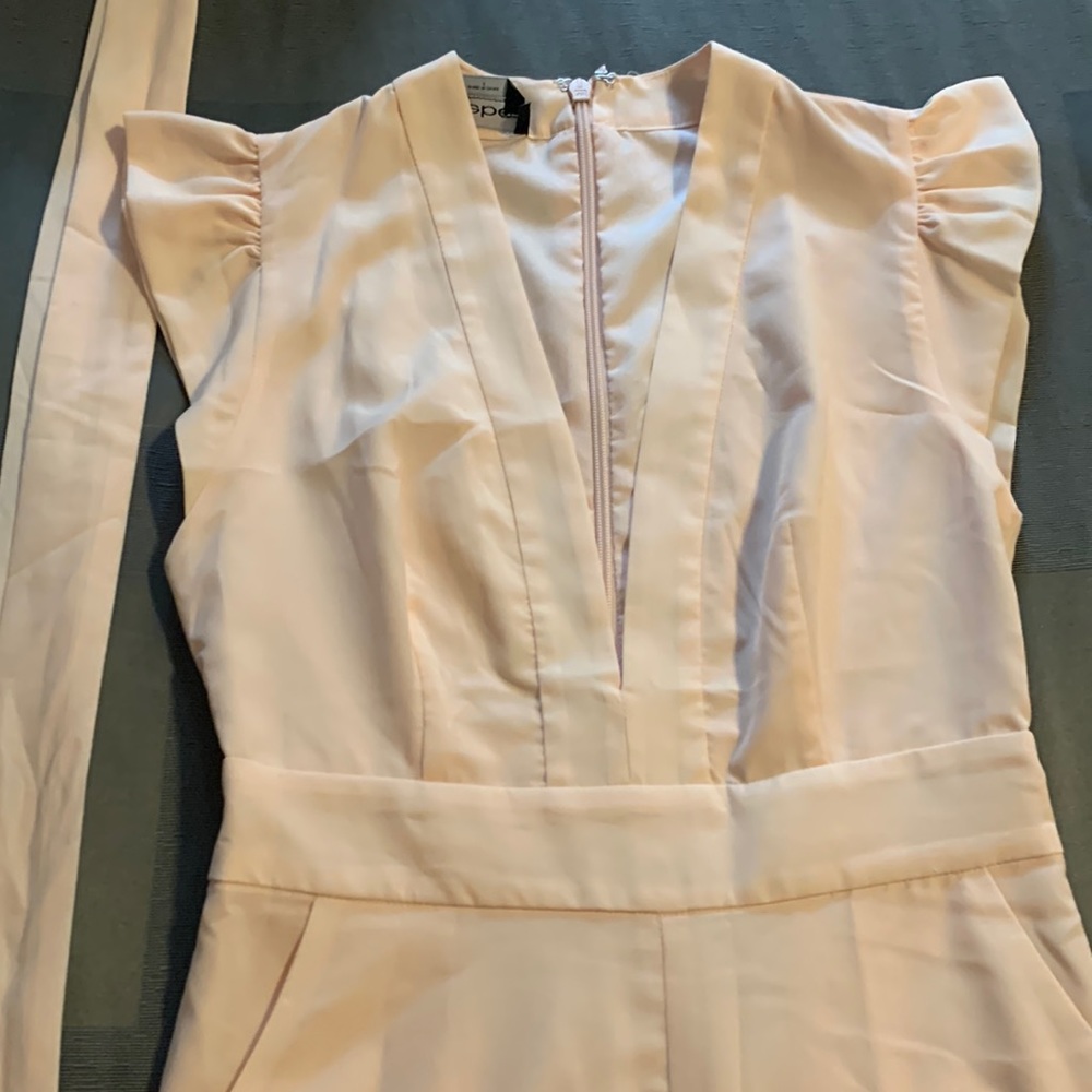 Light pink tie waisted Bebe jumpsuit